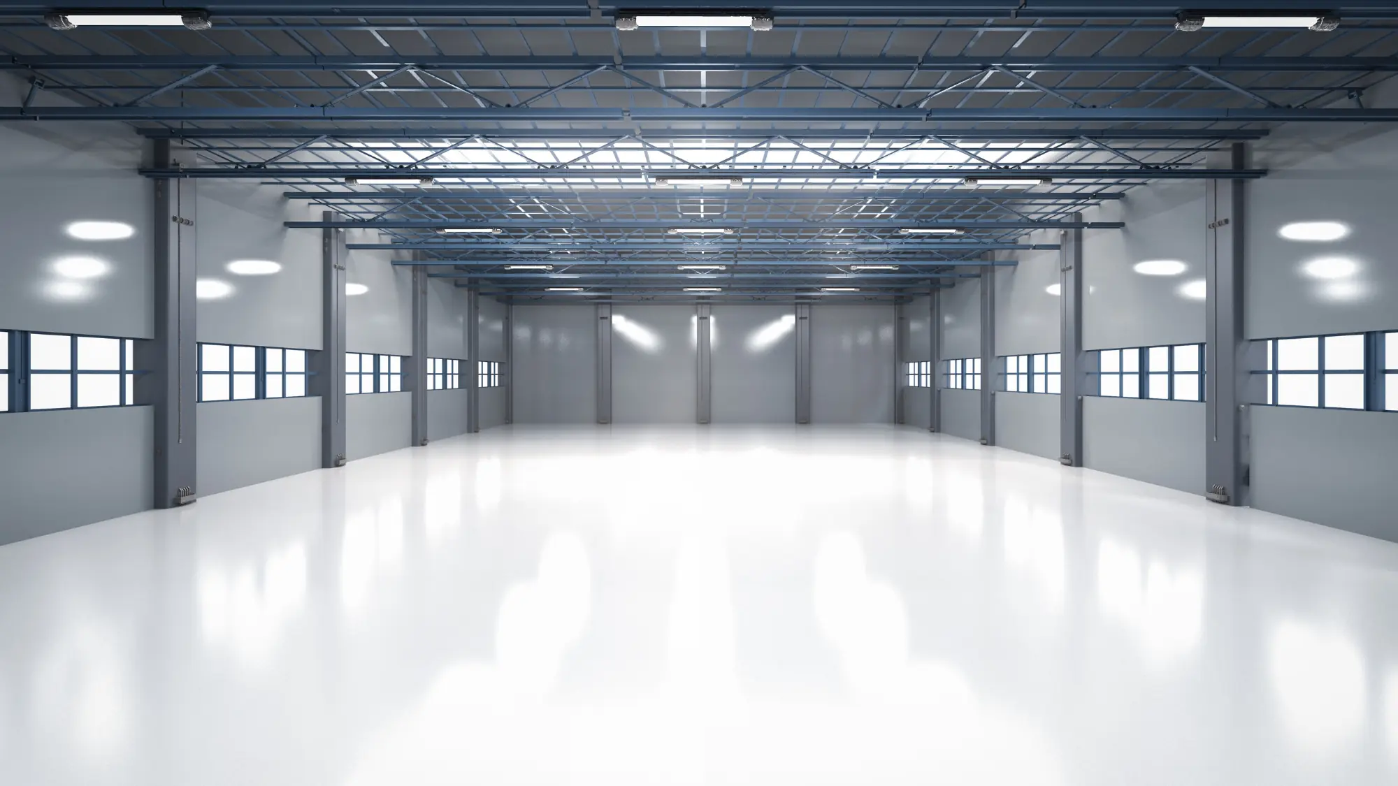 Interior de nave industrial terminada con piso epóxico e iluminación